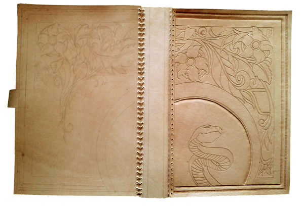 book cover with leather carving
