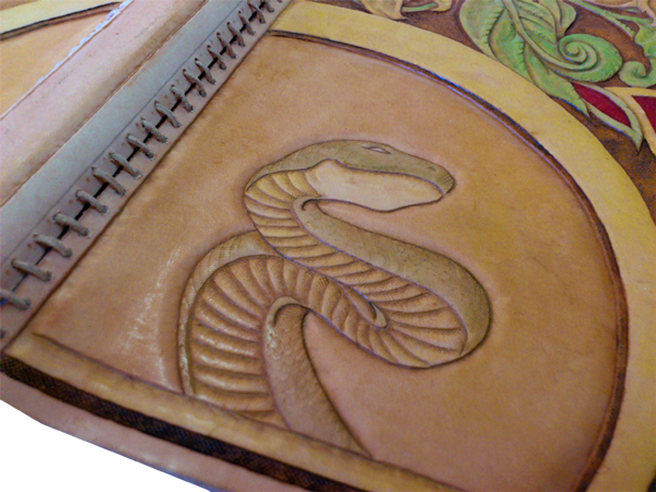 book cover with leather carving
